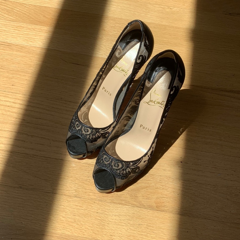 Never worn black lace Louboutin heels